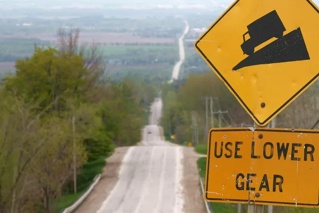 hill, road, warning sign, highway, rural, use lower gear, gear, lower, road sign, sign, yellow, warning. What Small Green Colorado Backroad Signs Mean