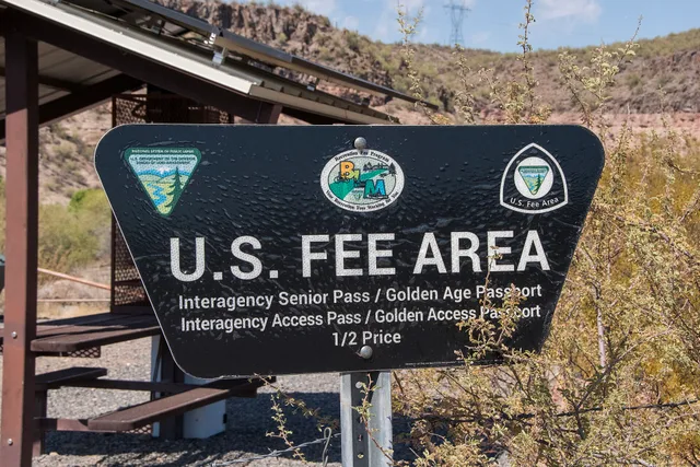 U.S. Fee Area sign at Burro Creek Campground , managed by the Kingman Field Office. Photo by Michelle Ailport/Bureau of Land Management Arizona. Road trip budgets cost: BLM fees at two stops